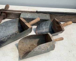 Gunnysacks And Metal Scoops And A Seed Planter.