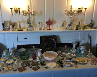 Cherub and flower candelabras.