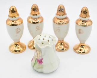 2 pairs of salt and pepper shakers and 1 single shaker with no stopper