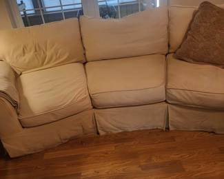 Couch with Slip covers.  Wash and wear.  Or wear and wash