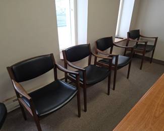 Appears to be walnut. Mid-century modern chairs