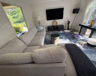 View of the side of the couch, plus additional living room furniture