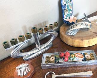Judaica – menorahs, mezuzah, small shofar horn, seder plate