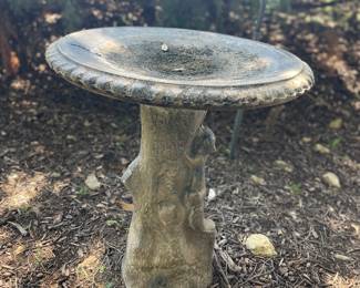 Concrete squirrel bird bath