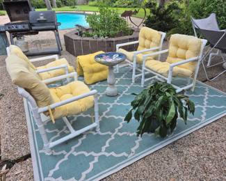 PVC chairs, ceramic bird bath, potted plant 