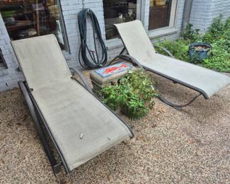Chaise lounge chairs, cement table w/ tile top, potted plant