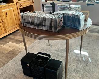 boom box, cd's and tapes, portable cd player and a smaller tape player
