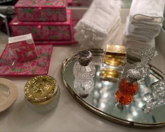finger tip towel, perfume, perfume bottles and mirrored vanity tray