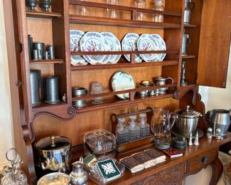 Sideboard with curio hutch.  Pewter, apothecary jars, coasters, porcelain plates and more!