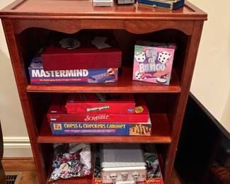 bookcase with games and cards