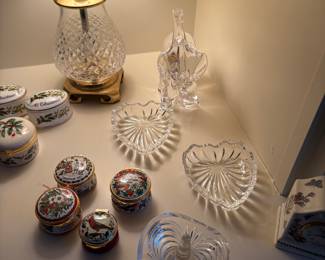 English enamel pill boxes, ring dishes, glass elephant, and Waterford lamp