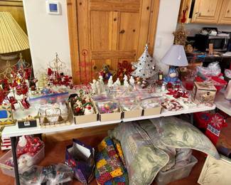 Lots and lots of christmas ornaments, lights, bulbs, everywhere, bedding