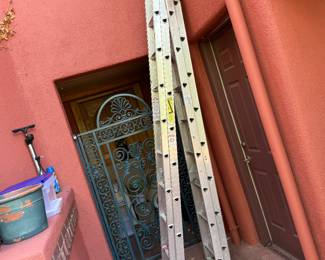 Ladders of many sizes, some aluminum