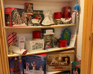 Another closet of large Christmas items, wreathes, candles, sprays