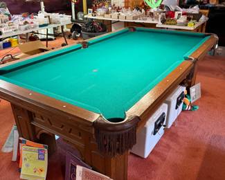 Unnamed pool table with balls and cue sticks