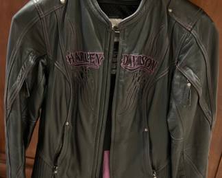 Harley Woman’s Leather Jacket w/Purple Lettering (size M),