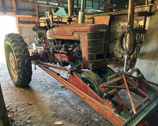 Farmall M tractor with snow plow attachment