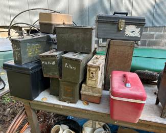Ammo boxes and vintage luggage.