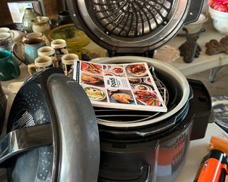 Ninja Foodi pressure cooker with instruction manual.