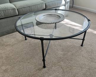 $150 Contemporary glass & iron coffee table; approx. 16" x 36 1/2"