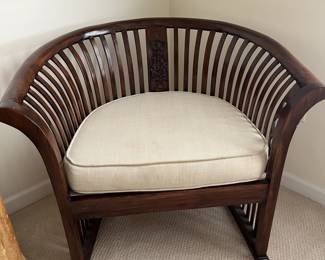 $100 Large slatted chair with carved center slat design; 28" H x 34" W x 27" D