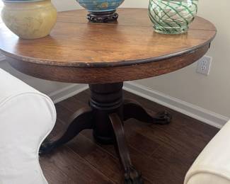 $250 Antique oak pedestal table; approx. 28" x 42" dia.