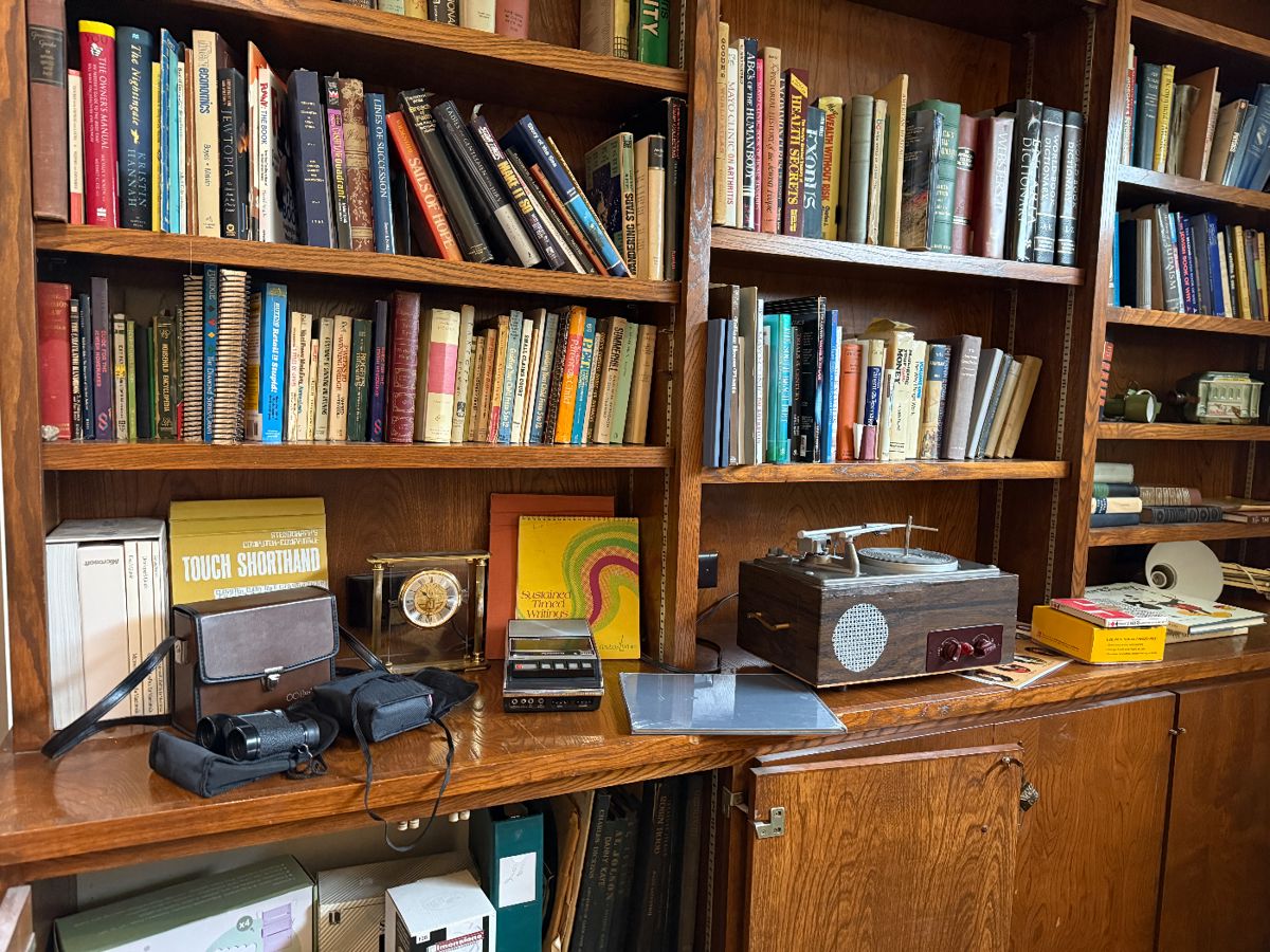 Vintage books, binoculars, projector