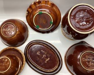 34 PCS HULL POTTERY BROWN DRIP GLAZE 34 PIECES INCLUDING NESTING DUCK, BUTTER DISH, 2 OAK LEAVES, STAG ASHTRAY AND MORE.