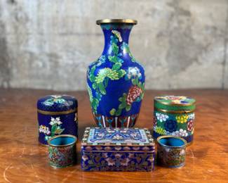 This lot features six (6) pieces of antique cloisonne pieces including two napkin rings, three (3) boxes/containers, & one (1) large vase. All appear to be in good condition.
