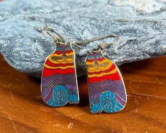 This lot features a pair of enamel earrings by Laurel Burch circa 1980s titled, “Rainbow Cats”. 
