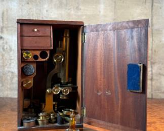 This lot features a stunning 19th century brass compound monocular microscope, manufactured by J. White of Glasglow in the original box case with accessories. Appears to be in very good condition. 
