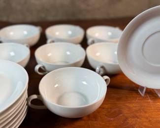 This lot features a collection of soup bowls and plates by Limoges in France. The collection includes seven (7) bowls, one (1) with crack and eight (8) plates. 
