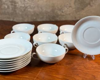 This lot features a collection of soup bowls and plates by Limoges in France. The collection includes seven (7) bowls, one (1) with crack and eight (8) plates. 
