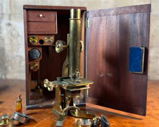 This lot features a stunning 19th century brass compound monocular microscope, manufactured by J. White of Glasglow in the original box case with accessories. Appears to be in very good condition. 
