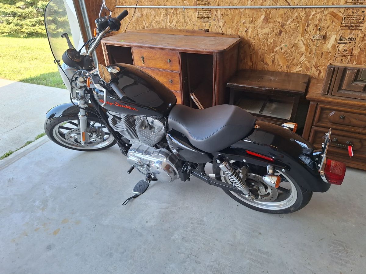 Harley Davidson Sportster. 1600 miles.
Like new. 2014.