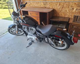 Harley Davidson Sportster. 1600 miles.
Like new. 2014.