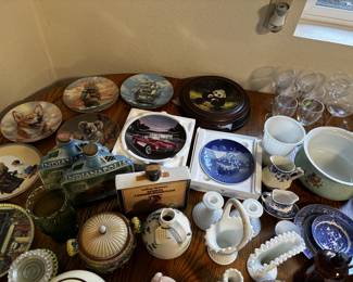 Assorted Collector Plates & Decorative Ceramics
Collection of themed decorative plates (wildlife, ships, dogs, cars, Bing & Grøndahl Christmas plate), plus blue-and-white china, milk glass vases, pitchers, and a few vintage souvenir bottles. Great mix for collectors or resellers.