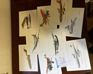 These are aviation art prints featuring classic Boeing aircraft, likely part of a collector’s series. The set includes illustrations such as the Boeing 727, 707, 314 Clipper, and others, all signed in print by the artist. Aviation enthusiasts and collectors often enjoy these for framing.