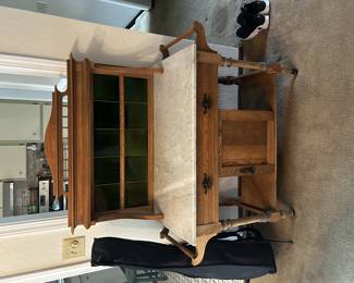 Antique oak sideboard with green glass backsplash and a white marble top. Features turned legs, a single drawer, and cabinet storage below. Beautiful statement piece in very good condition. 