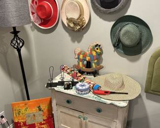 Small Cabinet and Women’s Hats