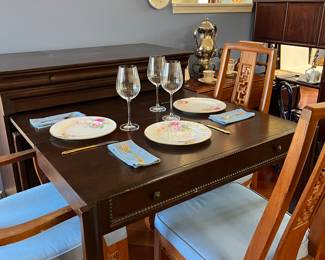 Butler's table pictured with one leaf. Two additional leaves come with it for additional seating.