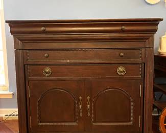 Impressive, butler's cabinet that transforms into a dining table.