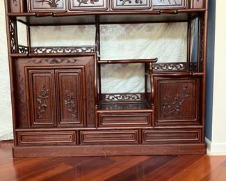 Decorative rosewood tea display and storage chest. Doors across top slide open, and depict the four seasons. 50" tall x 53 wide x 14.25 deep.