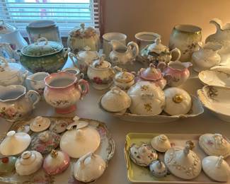 teapots, cream and sugars, lids, trays, plates, canisters, bowls