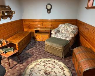 living room chair, ottoman, cedar chests, end tables, rugs