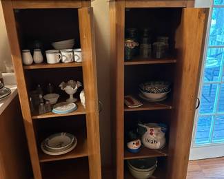 Vertical storage cabinets, antique mason jars, small plate sets, mugs, lamps
