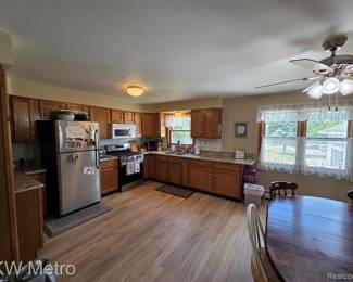 Cabinets, ceiling fan, light all the cupboards, upper and lowers, flooring and rugs too