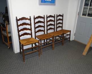 Four chairs, standing in a row