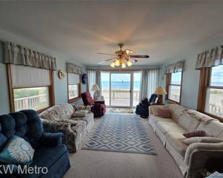 Window toppers, blinds and shades, area rug, couches, chairs, and loveseat along with the lamps, and pillows. Again the view has been sold, but we are offering free glances, and long stares start at $1