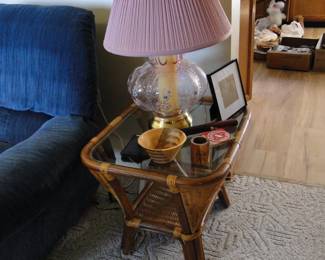 Rattan side table, we have a pair along with a pair of pink lamps too